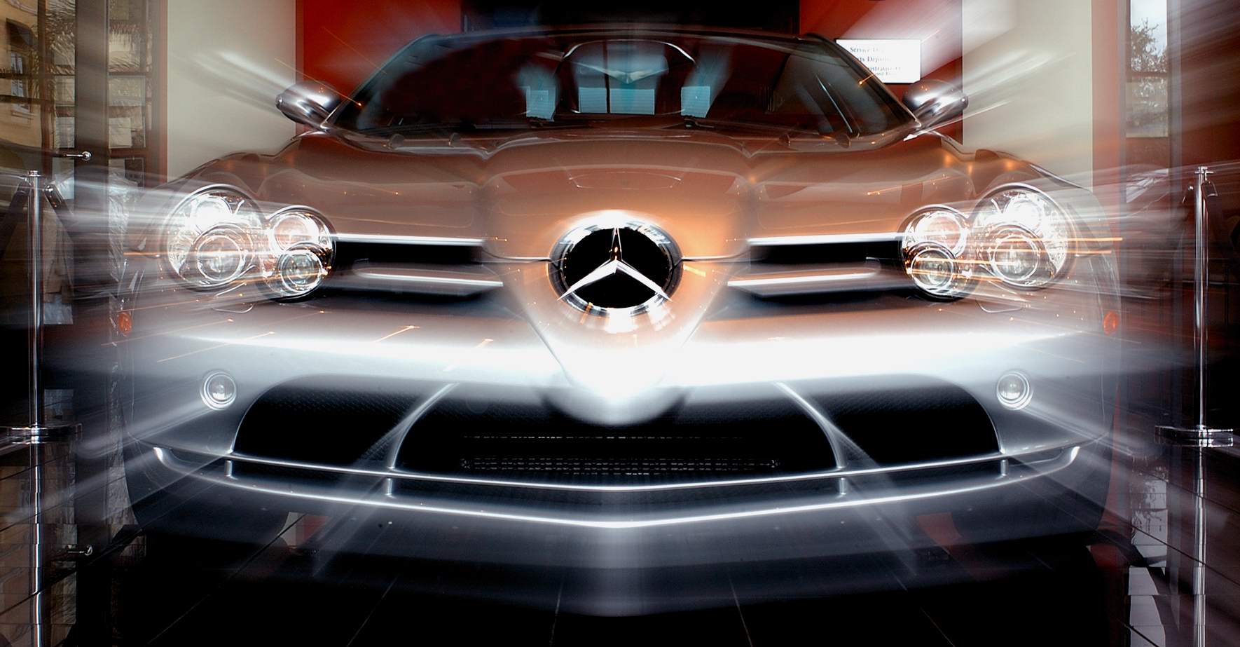 Front view of a Mercedes-Benz vehicle with headlights on